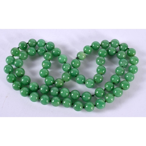 1249 - A GREEN JADE BEAD NECKLACE.  88 cm long, Bead size 11.2mm, weight 155g