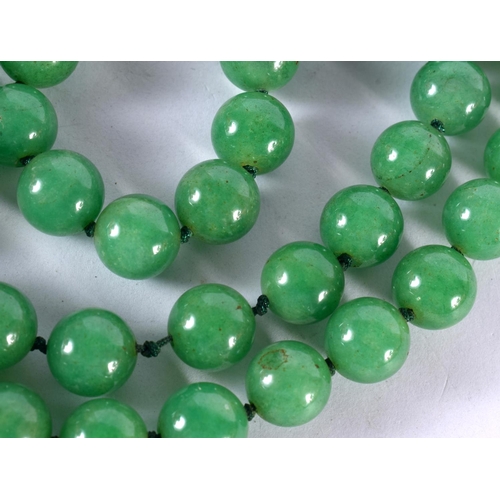 1249 - A GREEN JADE BEAD NECKLACE.  88 cm long, Bead size 11.2mm, weight 155g