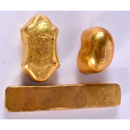 1250 - THREE YELLOW METAL WEIGHTS WITH CHINESE DECORATION (3)