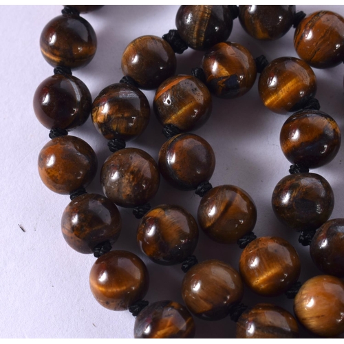 1267 - A TIGERS EYE BEAD NECKLACE. 97cm long, Bead size 7mm, weight 84g