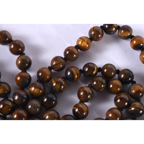 1267 - A TIGERS EYE BEAD NECKLACE. 97cm long, Bead size 7mm, weight 84g