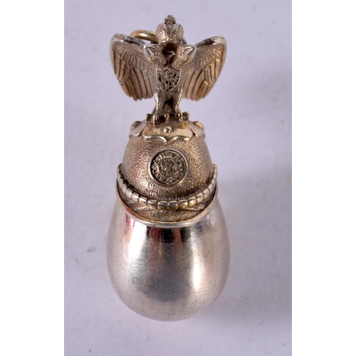 1268 - A SILVER EGG PENDANT TOPPED WITH A RUSSIAN IMPERIAL HELMET WITH AN EAGLE.  Stamped 84, 3.7cm x 1.4cm... 