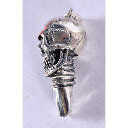 1270 - A SILVER SKULL WHISTLE WITH GEM SET EYES.  4.5cm x 1.5cm x 1.8 cm, weight 15.9g