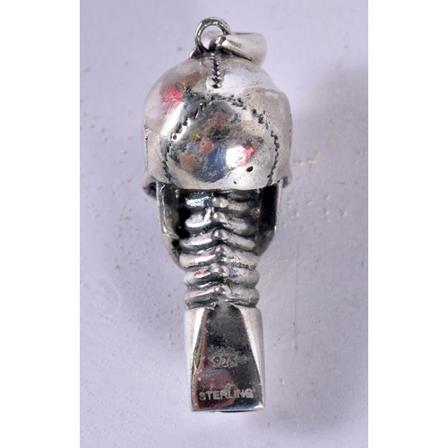 1270 - A SILVER SKULL WHISTLE WITH GEM SET EYES.  4.5cm x 1.5cm x 1.8 cm, weight 15.9g