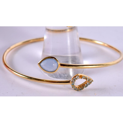 1275 - A SILVER GILT AND GEM SET MATCHING BANGLE AND RING.  Stamped 925, Ring size N, Bangle internal 6 cm ... 