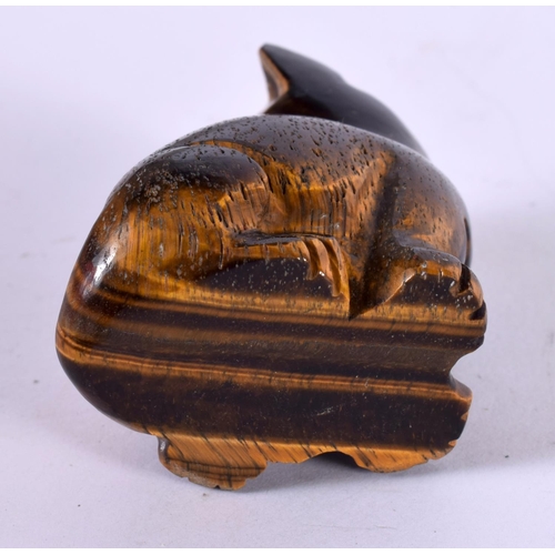 1279 - A CARVED TIGERS EYE CAT WITH GEM SET EYES.  5.8 cm x 4.4cm x 3.1cm, weight 101.6g