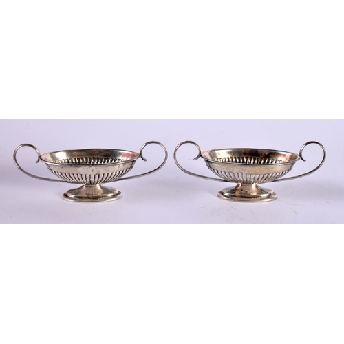 1287 - A PAIR OF SILVER CLASSICAL STYLE BOAT SHAPED SALTS.  Stamped Sterling, 7.6 cm x 2.6 cm x 3cm, total ... 