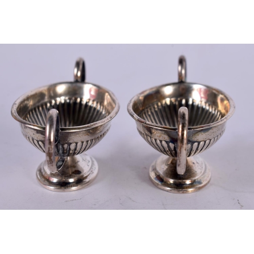 1287 - A PAIR OF SILVER CLASSICAL STYLE BOAT SHAPED SALTS.  Stamped Sterling, 7.6 cm x 2.6 cm x 3cm, total ... 