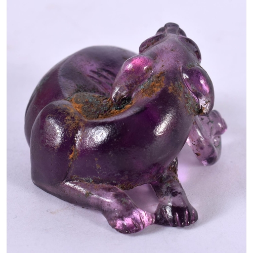 1289 - CHINESE CARVED AMETHYST FOO DOG.  5cm x 3.7cm x 2.4cm, weight 45.1g