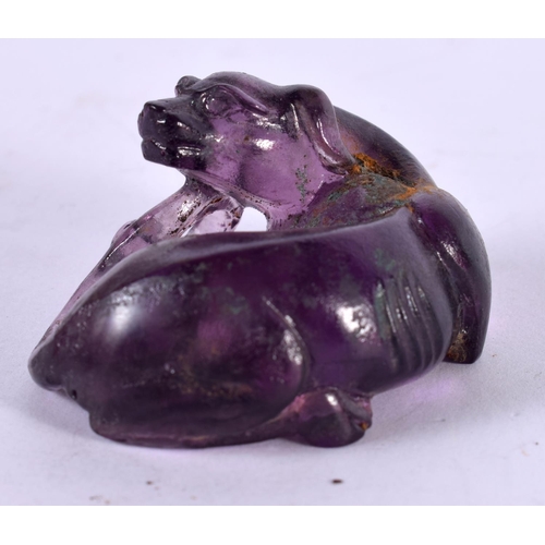 1289 - CHINESE CARVED AMETHYST FOO DOG.  5cm x 3.7cm x 2.4cm, weight 45.1g