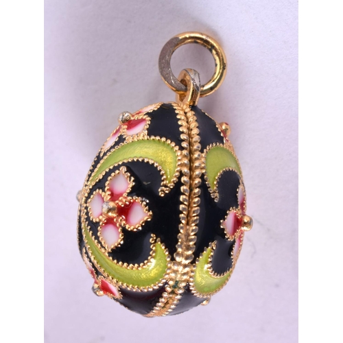 1292 - AN ENAMELLED EGG PENDANT.  2 cm x 1.4cm, weight 6.5g