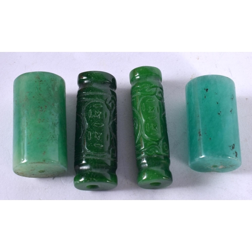 1294 - FOUR JADE BEADS.  Largest 3.6 cm x 2 cm, total weight 86g (4)