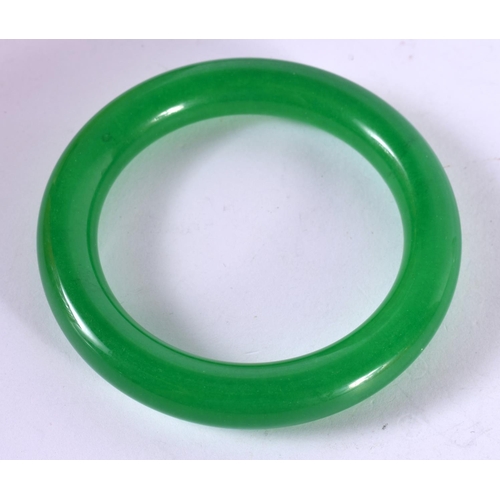 1299 - AN APPLE GREEN JADE BANGLE.  Internal 6.1cm, weight 72.8g