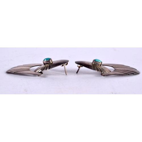 1305 - A PAIR OF SILVER AND TURQUOISE EARRINGS. 7.3 grams. 4.5 cm x 2 cm.