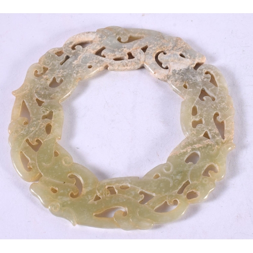 1312 - A CHINESE CARVED JADE ARCHAIC ROUNDEL. 53 grams. 10 cm diameter.