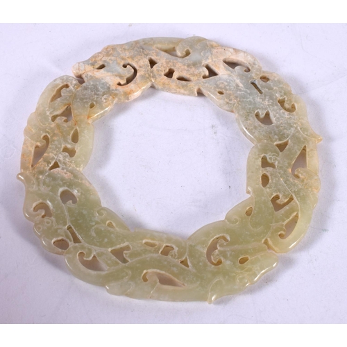 1312 - A CHINESE CARVED JADE ARCHAIC ROUNDEL. 53 grams. 10 cm diameter.