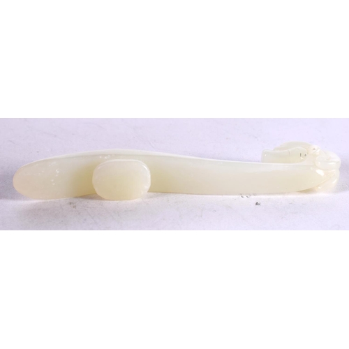 1313 - A CHINESE CARVED WHITE JADE BELT HOOK. 28 grams. 10 cm x 2 cm.