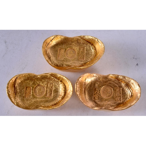 1340 - THREE CHINESE YELLOW METAL INGOTS. 263.2 grams. Largest 4.25 cm x 2.5 cm. (3)