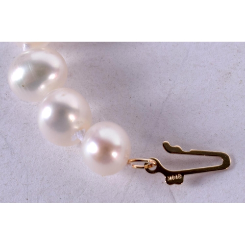 1344 - A STRING OF 14CT GOLD JADE AND PEARLS. 32 grams. 44 cm long.