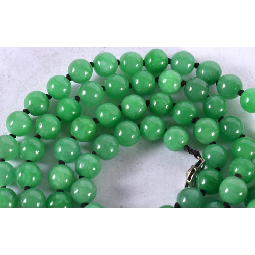 1345 - A 14CT GOLD JADE AND DIAMOND NECKLACE.131 grams. 138 cm long.