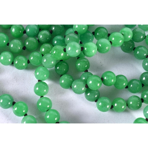 1345 - A 14CT GOLD JADE AND DIAMOND NECKLACE.131 grams. 138 cm long.