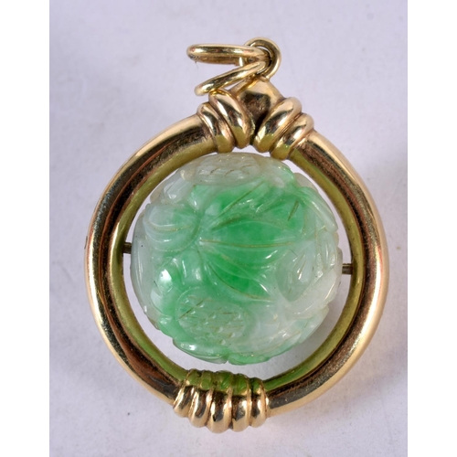 1347 - AN ANTIQUE CHINESE 14CT GOLD AND JADEITE REVOLVING PENDANT. 20 grams. 4.25 cm x 3 cm.