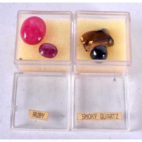 1348 - FOUR LOOSE GEMSTONES Ruby and Smoky Quartz. 5.6 grams. Largest 4.25 cm x 3 cm. (4)