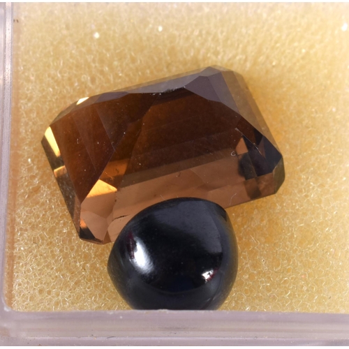 1348 - FOUR LOOSE GEMSTONES Ruby and Smoky Quartz. 5.6 grams. Largest 4.25 cm x 3 cm. (4)