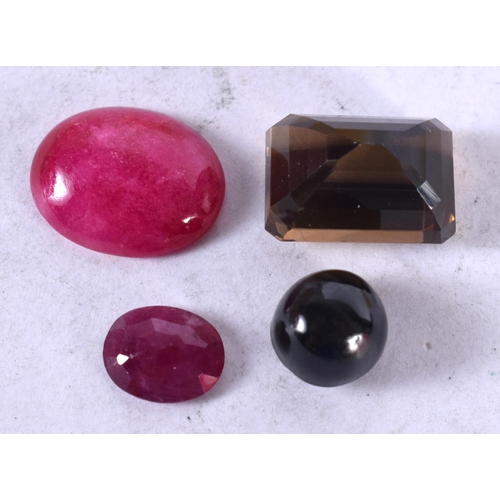 1348 - FOUR LOOSE GEMSTONES Ruby and Smoky Quartz. 5.6 grams. Largest 4.25 cm x 3 cm. (4)