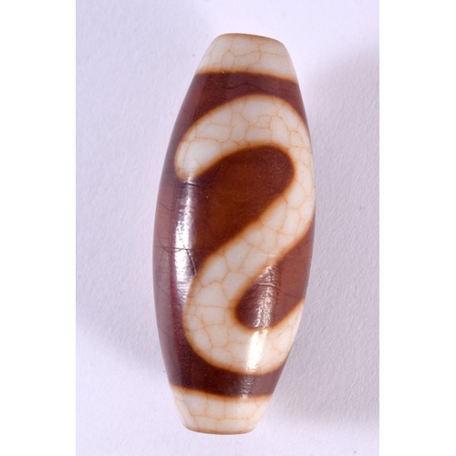 1353 - A CHINESE TIBETAN AGATE ZHU BEAD. 26.9 grams. 5 cm x 2 cm.