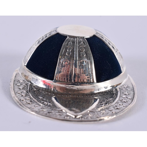 1356 - A SILVER JOCKEY HAT PIN CUSHION. 20 grams. 5.25 cm x 4 cm.