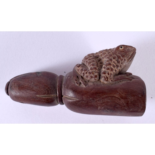 1365 - A JAPANESE CARVED WOOD FROG NETSUKE. 27.6 grams. 7.5 cm x 3.75 cm.