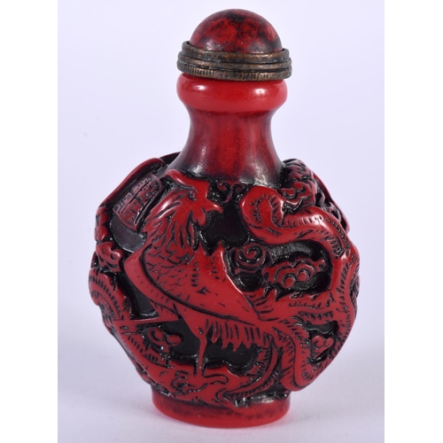 1373 - A CHINESE RED LACQUER SNUFF BOTTLE AND STOPPER. 8 cm x 5.25 cm.