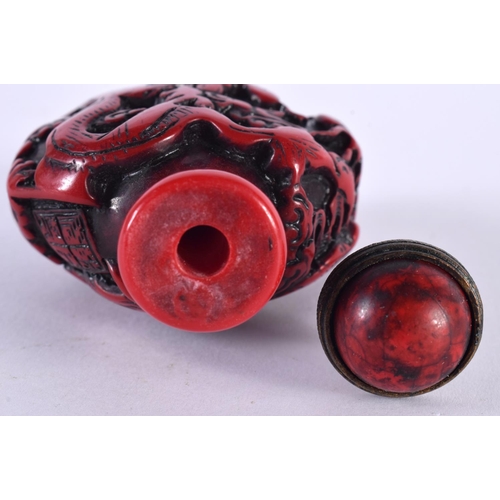 1373 - A CHINESE RED LACQUER SNUFF BOTTLE AND STOPPER. 8 cm x 5.25 cm.