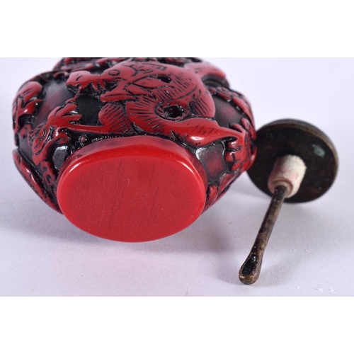 1373 - A CHINESE RED LACQUER SNUFF BOTTLE AND STOPPER. 8 cm x 5.25 cm.