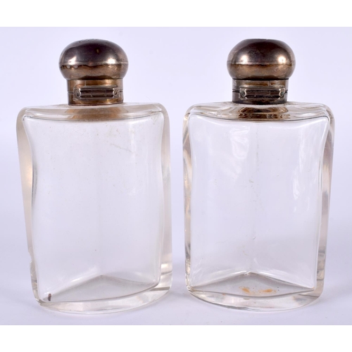 1385 - TWO SILVER TOPPED BOTTLES.  Hallmarked London 1907, 12.8 cm x 7.2 cm x 4.2 cm (2)