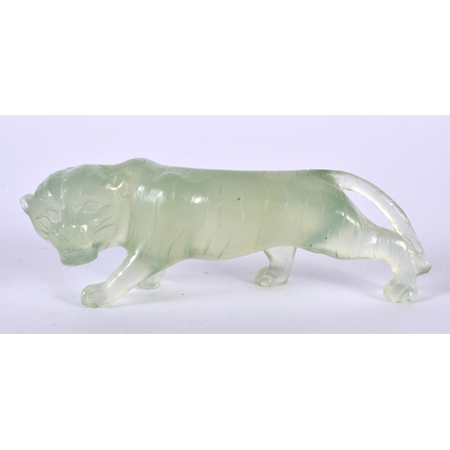 1386 - A CARVED JADE TIGER.  9cm x 2.8 cm x 2 cm, weight 44g