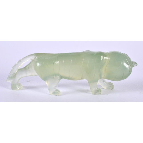 1386 - A CARVED JADE TIGER.  9cm x 2.8 cm x 2 cm, weight 44g