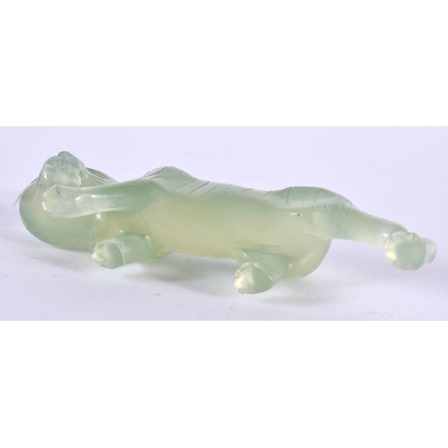 1386 - A CARVED JADE TIGER.  9cm x 2.8 cm x 2 cm, weight 44g