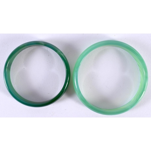 1388 - TWO GREEN JADE BANGLES.  Internal 6.5cm, total weight 49g (2)