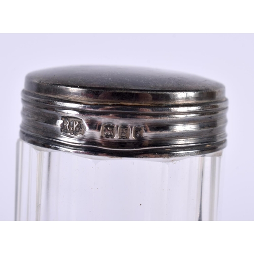 1395 - FOUR SILVER TOPPED DRESSING TABLE JARS.  Largest 12.8 cm x 3.3cm (4)