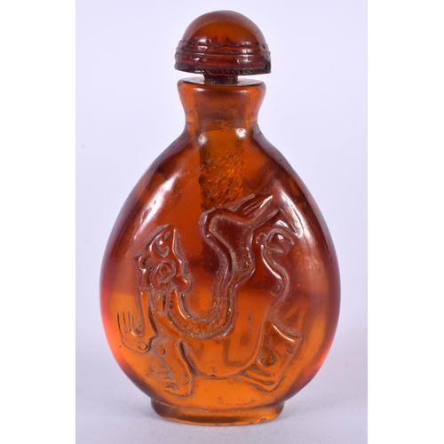 1406 - AN AMBER COLOURED SNUFF BOTTLE.  7.5cm x 4.5cm x 2.7cm, weight 48.7gg