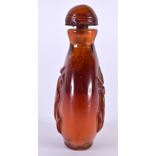 1406 - AN AMBER COLOURED SNUFF BOTTLE.  7.5cm x 4.5cm x 2.7cm, weight 48.7gg