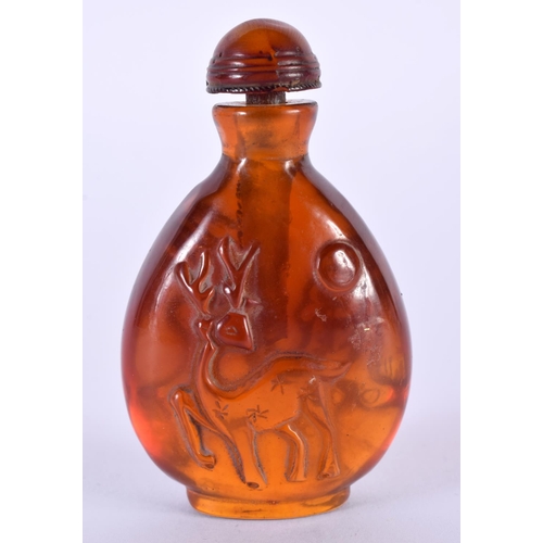 1406 - AN AMBER COLOURED SNUFF BOTTLE.  7.5cm x 4.5cm x 2.7cm, weight 48.7gg