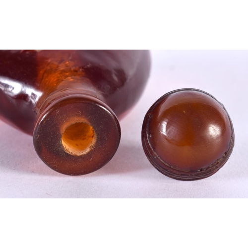 1406 - AN AMBER COLOURED SNUFF BOTTLE.  7.5cm x 4.5cm x 2.7cm, weight 48.7gg