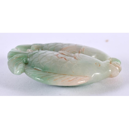 1414 - A JADE ROUNDEL CARVED WITH FISH.  5.5cm x 1.4cm, weight 56.3g