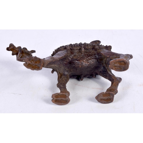 1427 - A BRONZE MODEL OF A CAMEL.  8.3cm x 3cm x 5.5cm, weight 131.4g