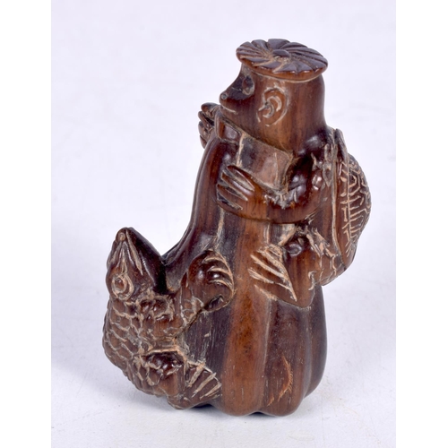 1435 - A CARVED WOOD NETSUKE IN THE FORM OF A TOAD AND A TURTLE CLIMBING A TREE STUMP.  6.1cm x 4.3cm x 2.8... 