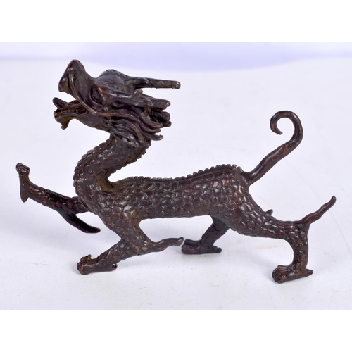 1436 - A BRONZE MODEL OF A DRAGON.  10.6 cm x 7.1cm x 2.1cm, weight 161g