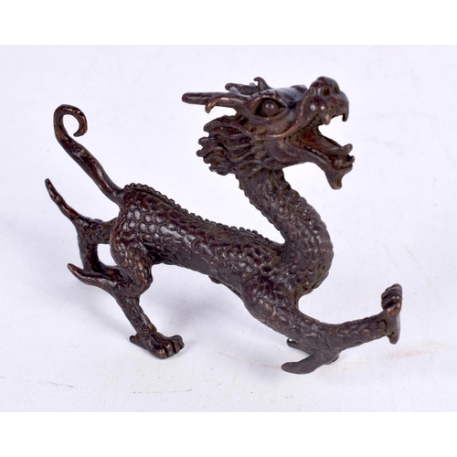 1436 - A BRONZE MODEL OF A DRAGON.  10.6 cm x 7.1cm x 2.1cm, weight 161g